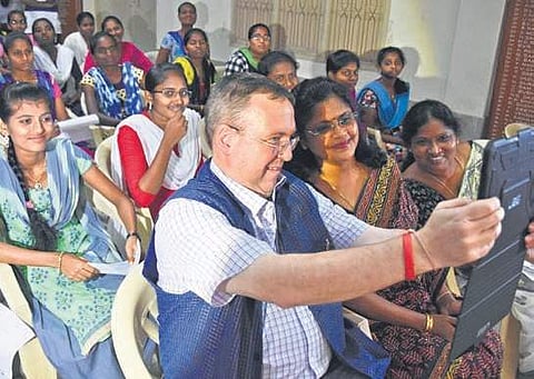 British Deputy High Commissioner Andrew Fleming taking a selfie during the launch of Barefoot Lawyers helpline in Vijayawada on Thursday (Photo| EPS, P Ravindra Babu)