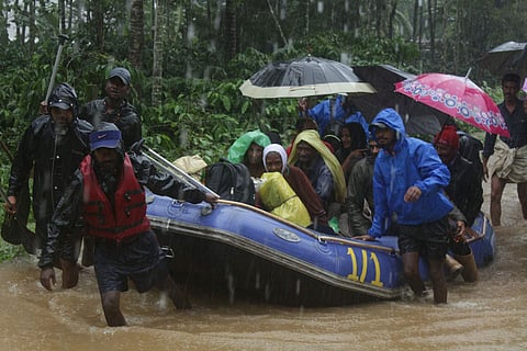 Image used for representational purpose only | A family rescued by private rafters near Murnad in Coorg. (Photo | EPS)