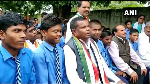 Chhattisgarh Minister Kawasi Lakhma with students at a Teachers Day event in the state. 