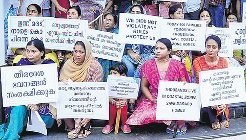 Residents of Holy Faith H2O apartments protest with placards on Monday | A Sanesh