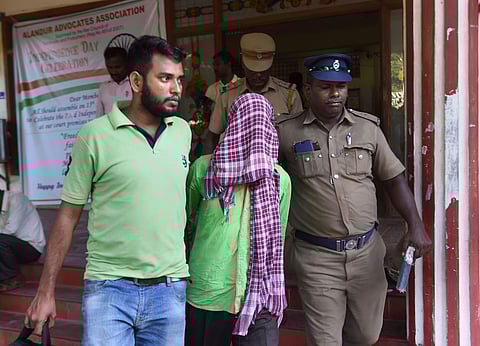 Terror-suspect Asadullah being escorted by the police personnel after he was produced at Alanthur court in Chennai. (Photo| PTI)