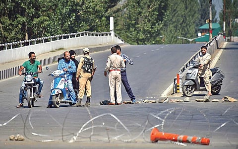 Security personnel stop two-wheelers for checking during curfew like restrictions in Srinagar on Tuesday | PTI