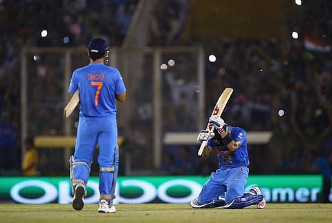 Kohli tweeted the image of the epic game played at the PCA Stadium in Mohali where he can be seen celebrating the victory while being on his knees while Dhoni is walking towards him. (Photo | Twitter)
