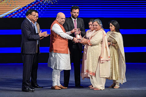 Home Minister Amit Shah presents a memento to family members of the late politician-cum-sports-administrator Arun Jaitley at an event to rename Feroz Shah Kotla Stadium as 'Arun Jaitley Stadium' during DDCA's Annual Awards function in New Delhi Thursday S