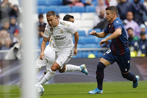 Real Madrid's Eden Hazard (L) vies for the ball with Levante's Enis Bardhi during Spanish La Liga (Photo | AP)