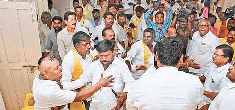 TDP party leaders fight among themselves, over defection of party leaders, during a parliamentary committee meeting in Nalgonda on Friday