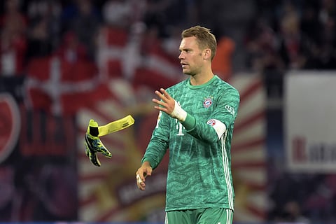Bayern's goalkeeper Manuel Neuer throws a glove after the German Bundesliga soccer match between RB Leipzig and FC Bayern Munich in Leipzig, Germany, Saturday, Sept. 14, 2019. | AP