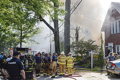 First responders work at the scene of a house fire on Garland Street in Edgewood. (Photo | AP)