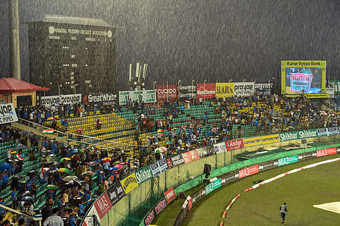 Spectators seen at the Himachal Pradesh Cricket Association stadium as it rains ahead of India's first T-20 cricket match against South Africa in Dharamshala. (Photo | PTI)