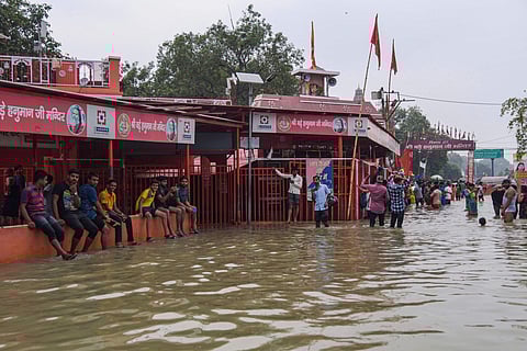 File photo of Bade Hanuman temple which is partially submerged under flood waters of River Ganga in Prayagraj. (Photo| PTI)