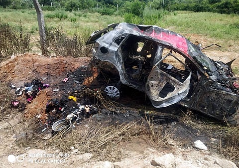 The remains of the car that went up in flames after overturning at Mamadugu in Gangavaram mandal of Chittoor district. (Photo | EPS)