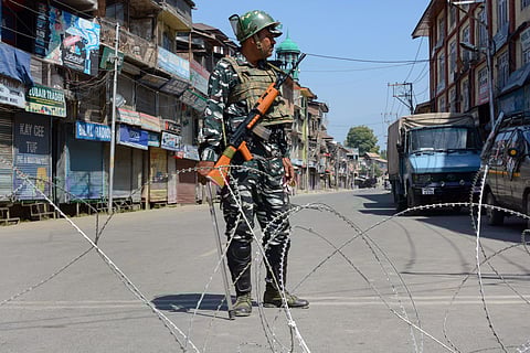 An Indian Army soldier patrols curfewed street of Kashmir. (Photo| PTI)