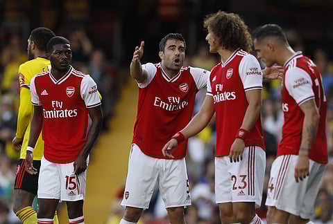 Arsenal's Sokratis Papastathopoulos, center, gestures as he shouts at his teammates during their EPL encounter against Watford. (Photo | AP)