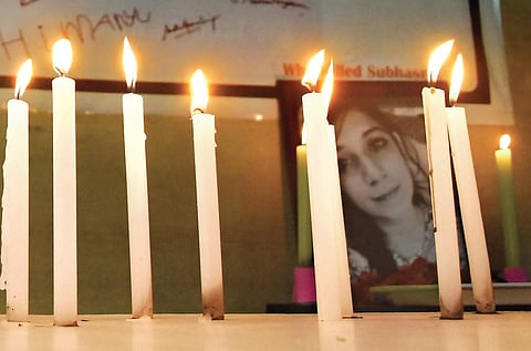 A candle light vigil arranged for Subasri and Raghu, who lost their lives after banners fell on them, in Egmore on Sunday. (Photo | Ashwin Prasath)