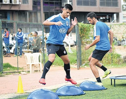 Eugeneson Lyngdoh (L) during a training session