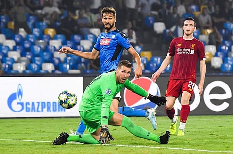 Napoli's Spanish forward Fernando Llorente (C) scores past Liverpool's Spanish goalkeeper Adrian. (Photo | AFP)