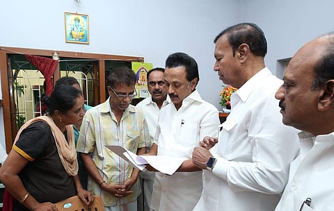DMK chief Stalin meets the parents of Chennai techie Subashri who died after being hit by a water tanker when a banner erected by AIADMK functionaries allegedly fell on her. (Photo | Twitter)
