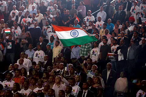 Supporters wave an Indian flag as Prime Minister Narendra Modi prepares to address during a reception organised in his honour by the Indian American Community Foundation at Madison Square Garden in New York. | ( Photo | PTI )