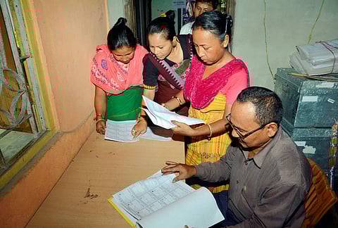 Bodo women check their names in the final list of National Register of Citizens NRC at an NRC Seva Kendra at Bagan Para in Baska district of Assam Monday September 2 2019. | PTI