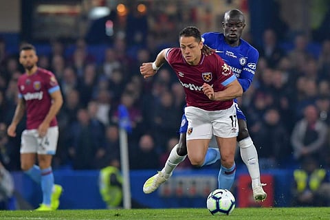 Javier Hernandez dribbles the ball past Chelsea's N'Golo Kante. (Photo | AFP)
