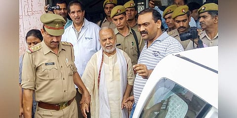 Shahjahanpur: Former Union minister Swami Chinmayanand, accused of rape by a law student, is seen outside a government hospital after a medical examination following his arrest by a special team of Uttar Pradesh police, in Shahjahanpur, Friday, Sept. 20, 