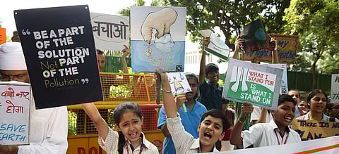 School childrens shout slogans in front of the Ministry of Housing and Urban Affairs in New Delhi on Friday. (Photo | Shekhar Yadav, EPS)
