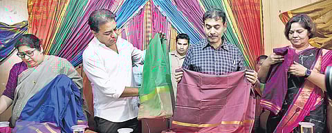 Minster KT Rama Rao, IT Secretary Jayesh Ranjan, and Director of Handlooms,Textiles and Apparel Export Parks Shailaja Ramaiyer take a look at Bathukamma sarees at CDMA office in Hyderabad on Thursday