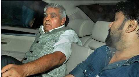 West Bengal Governor Jagdeep Dhankar with MoS Babul Supriyo sit inside a car after being heckled at the Jadavpur University. (Photo | PTI)