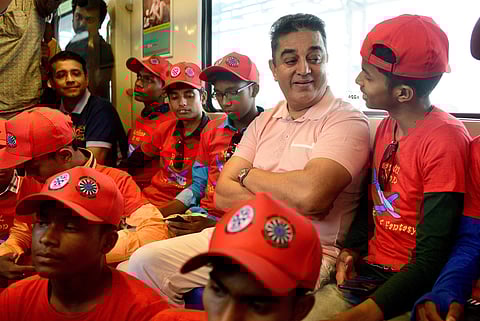 Makkal Needhi Maiam founder Kamal Haasan interacts with the students who travelled in  Metro train with him as part of `Flight of Fantacy' programme in Chennai. (Photo | Express)