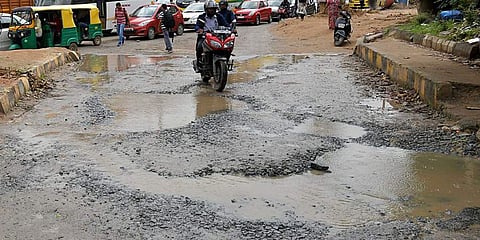 The roads on Sarjapur Junction are pothole-ridden causing a lot of inconvenience to the commuters. (Photo | Meghana Sastry, EPS)