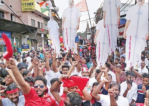 Supporters cheer for LDF candidate Mani C Kappan during the grand finale  (kottikkalasam) of the campaigning in Pala on Friday | Vishnu Prathap