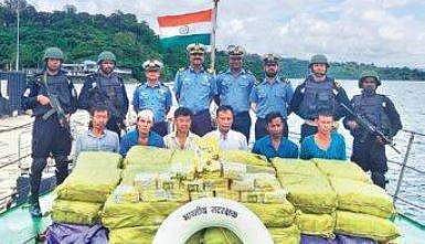 ICG personnel with apprehended Myanmar nationals | Express