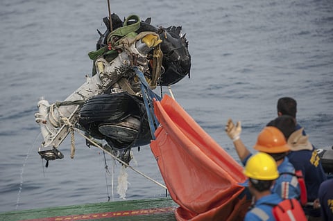 Rescuers use crane to retrieve part of the landing gears of the crashed Lion Air jet from the sea floor in the waters of Tanjung Karawang, Indonesia, Sunday, Nov. 4, 2018. | (File | AP)