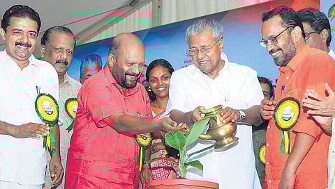 Chief Minister Pinarayi Vijayan watering a plant during the inauguration of the Banana and Honey Park at Kannara in Thrissur on Monday. Agriculture Minister V S Sunil Kumar and Ollur MLA K Rajan are seen | Express