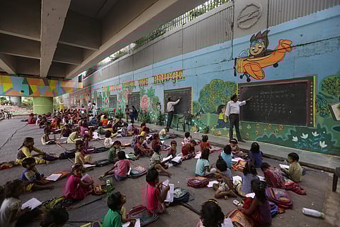 Rajesh Kumar Sharma runs 'The Free School Under The Bridge' in Delhi's Yamuna Bank area. (Photo | Arun Kumar, EPS)