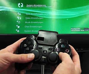 A man operates a Sony Playstation 3 console at an electronics shop in Mainz (File photo| AP)