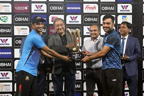 Bangladesh skipper Shakib Al Hasan and Afghanistan skipper Rashid Khan share the trophy. (Photo | Twitter/@BCBTigers)