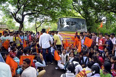 Students protesting by conducting Raasta Roko at Bekwad cross in Khanapur on Wednesday (Express Photo)