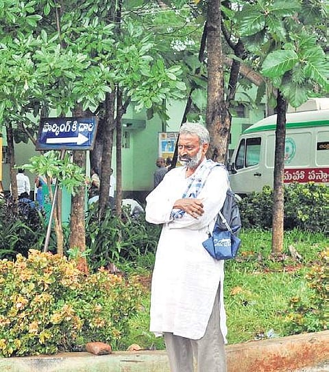 MR Prasad waits in front of the Rajamahendravaram GGH for any information of his relatives | Express