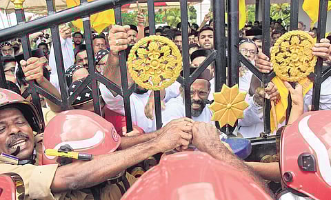 Disregarding the protest by the Jacobite faction, Fire Force personnel break open the gates to enter St Mary’s Syrian Cathedral at Piravom on Thursday. |  (Arun Angela | EPS)