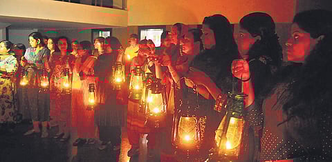 With KSEB and Kerala Water Authority officials disconnecting the power and water supply, residents of Holy Faith H2O light lanterns and candles in protest against the SC verdict to demolish the four complexes | A Sanesh