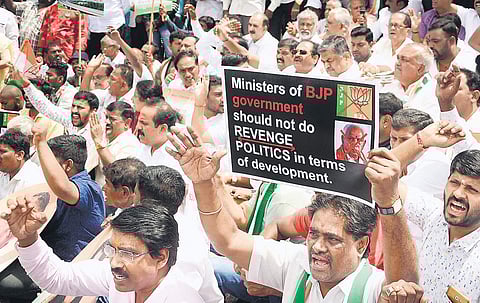 Congress leader Ramalinga Reddy protests against the state government for allocating less funds to Congress held constituencies, at Town hall on Thursday  | Shriram BN
