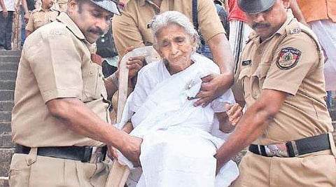 An elderly woman being carried away from the Piravom church on  Thursday | ARUN ANGELA