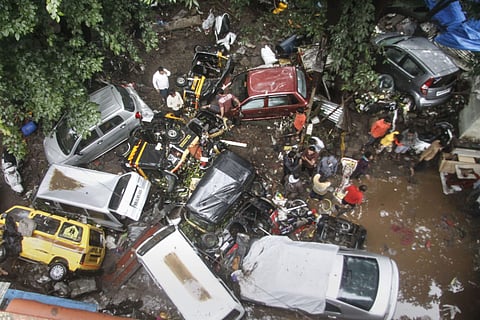 Vehicles are piled up on a street after a flash flood following heavy rains in Pune. (Photo | PTI)