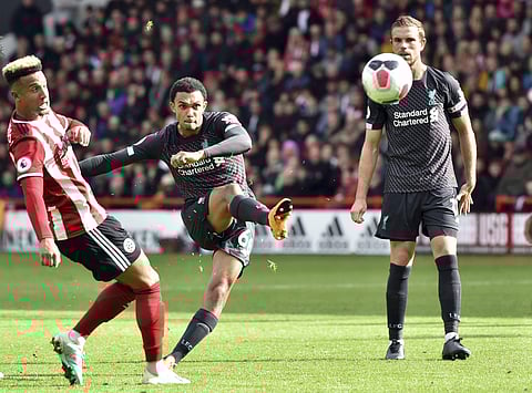 Liverpool's Trent Alexander-Arnold, center, takes a free kick. (Photo | AP)