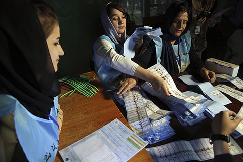 Afghan election workers count ballots during the presidential elections, at a polling station in Kabul, Afghanistan. (Photo | AP)