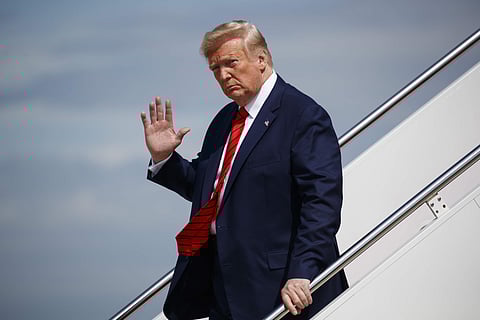 In this Sept. 26, 2019 photo, President Donald Trump waves to reporters as he steps off Air Force One after arriving at Andrews Air Force Base, in Andrews Air Force Base, Md. | (File | AP)