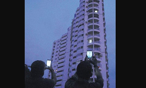 People taking photographs of Holy Faith H20 flat at Maradu | A sanesh