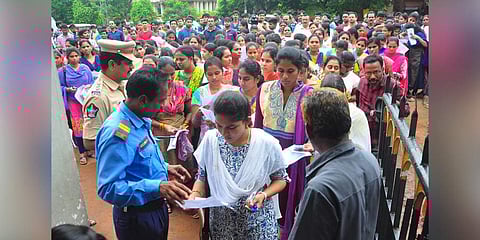 Peoples attend to Grama Sachivalayam Exam at Bullaya College In Visakhapatnam.  (Photo | G Satyanarayana, EPS)
