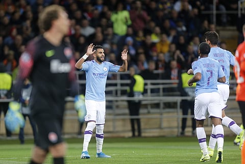 Manchester City's Riyad Mahrez, center, celebrates after scoring. (Photo | AP)
